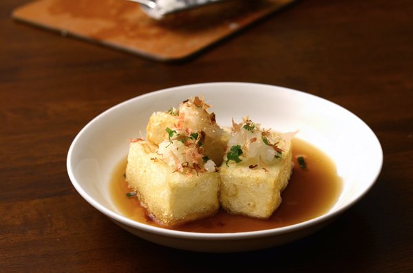 Representative photograph of Agedashi Tofu. The photograph includes bonito-style flakes; this recipe uses kombu broth without fish flakes.