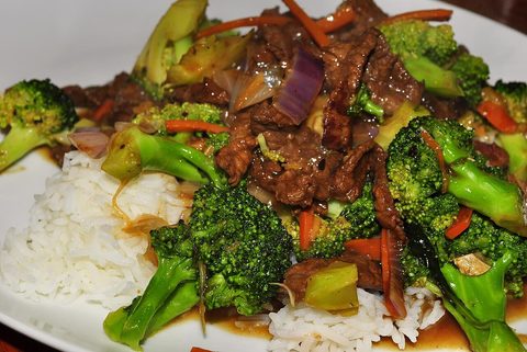 Representative photograph of Beef and Broccoli. The photograph includes rice and extra vegetables; rice is not included in this recipe.
