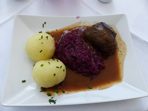 Representative photograph of Beef Rouladen. The photograph includes dumplings and red cabbage not included in this recipe.