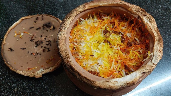 Lucknowi mutton matka dum biryani in a clay pot. This photograph shows mutton, not the chicken recipe on this site.