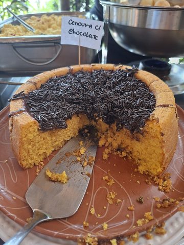 Representative photograph of Brazilian Carrot Cake. The photograph uses a ring mould and chocolate sprinkles; this recipe uses a round tin and a chocolate glaze.