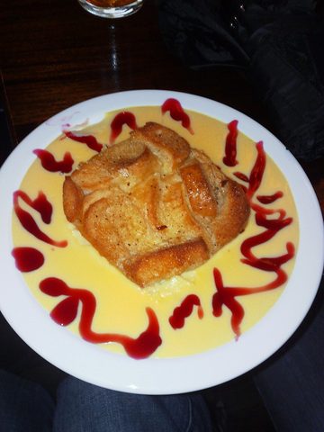 Representative photograph of Bread and Butter Pudding. The photograph includes custard and fruit sauce not included in this recipe.