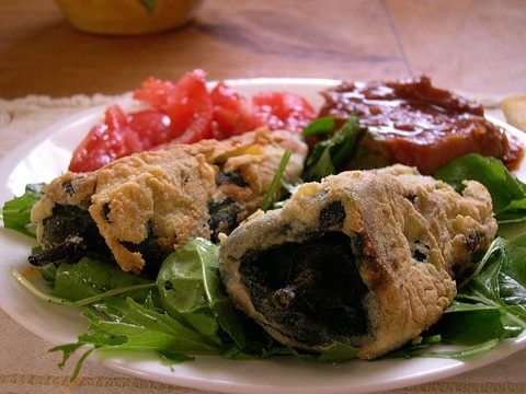 Representative photograph of Chiles Rellenos. The photograph includes side salad and uses a different presentation from this recipe.