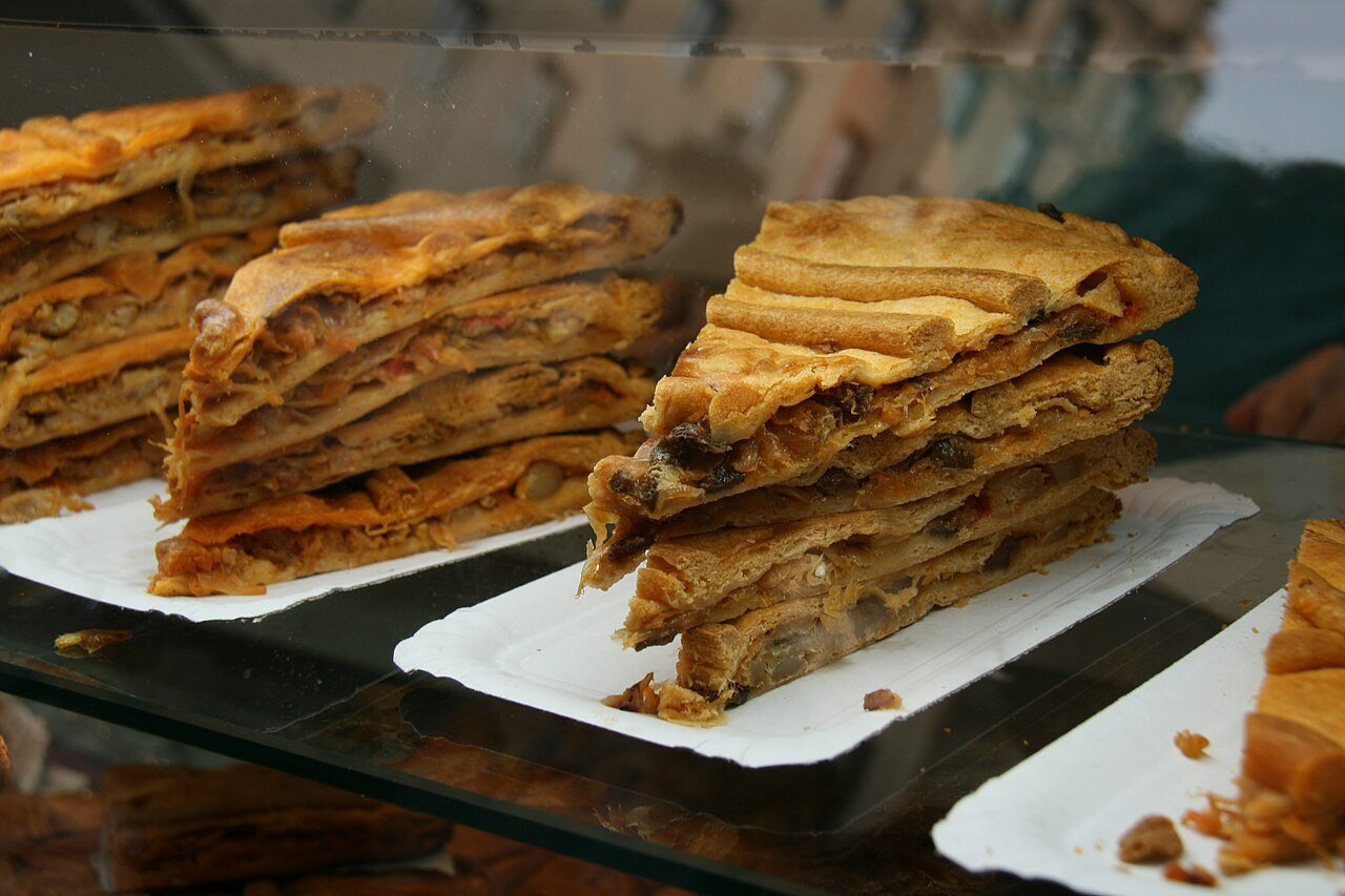 Representative photograph of Empanada Gallega. The source identifies Galician empanadas but does not identify the filling. This recipe uses tuna.