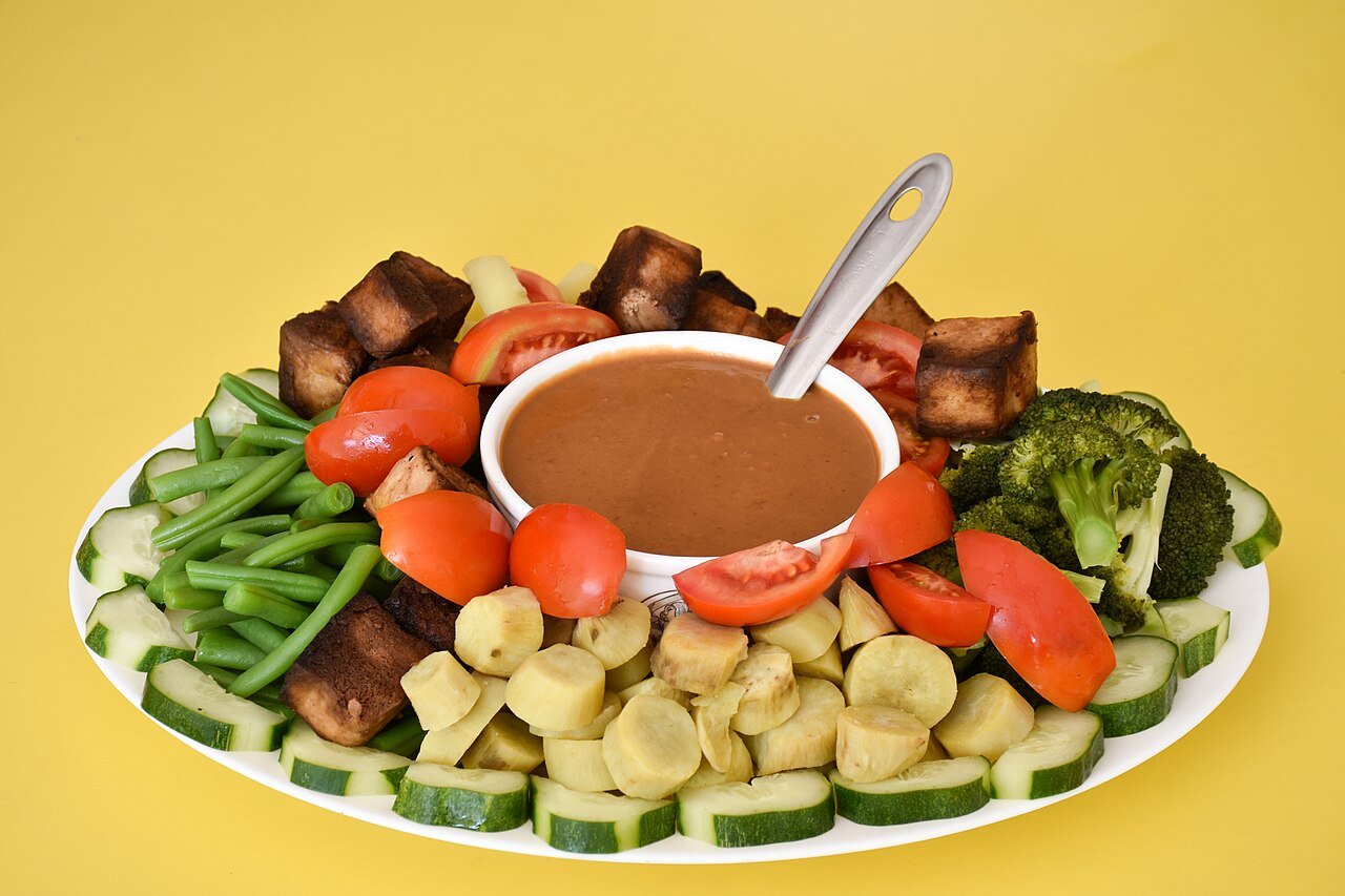 Representative photograph of Gado Gado. The photograph shows a different selection of vegetables with the peanut sauce.