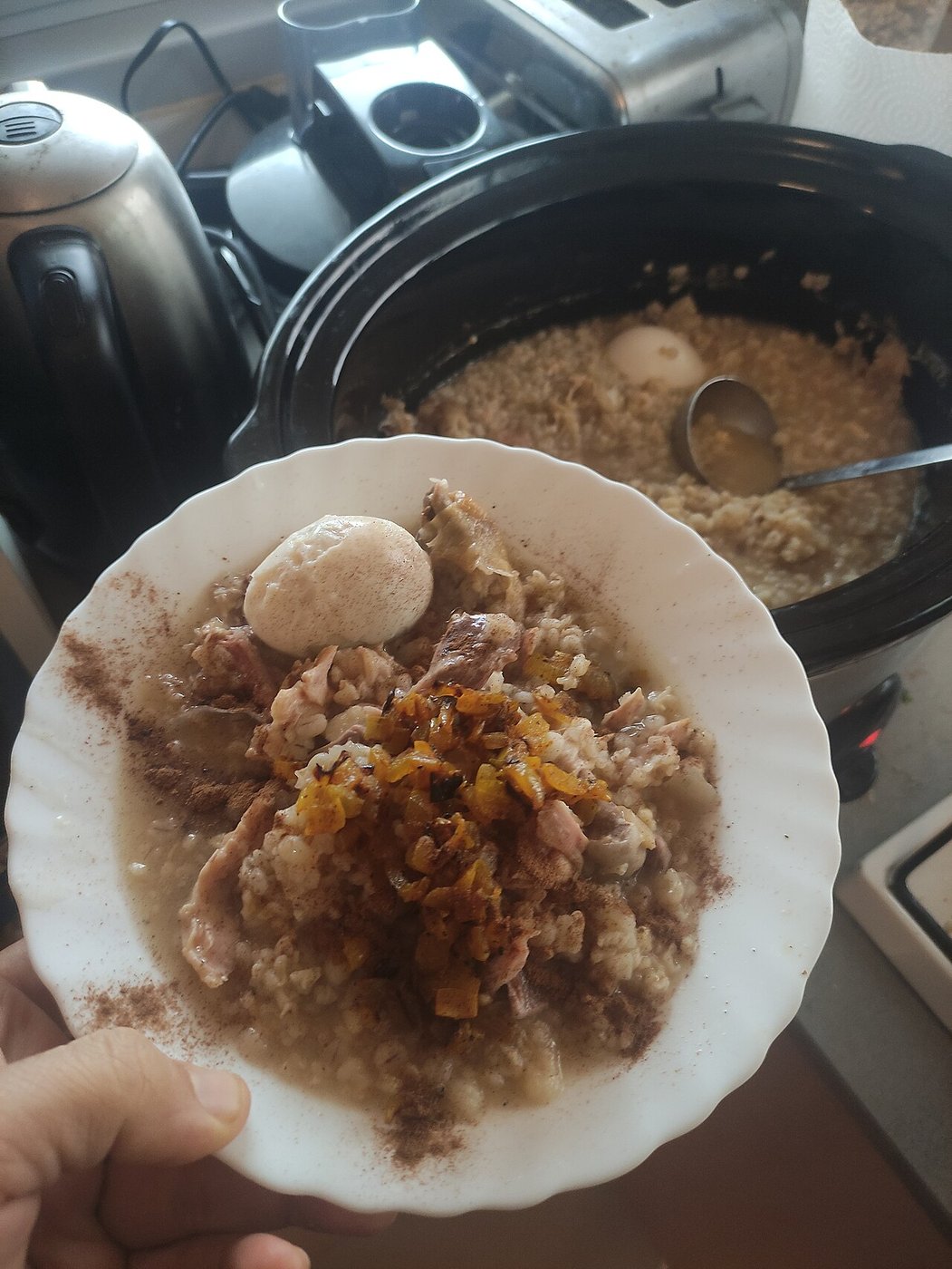 Representative photograph of Haleem. The source does not establish the meat variety. This recipe uses beef; the photographed garnish also differs.