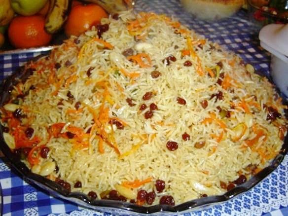 Representative photograph of Kabuli Pulao. The source identifies Afghan palaw but does not establish the meat variety. This recipe uses lamb.