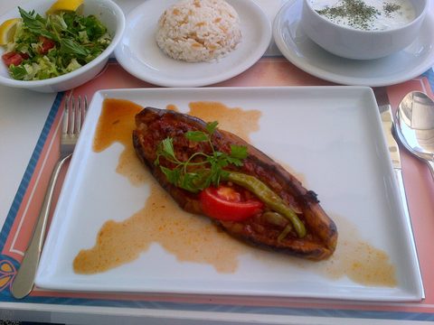 Representative photograph of Karniyarik. The photograph includes side dishes not included in this recipe.