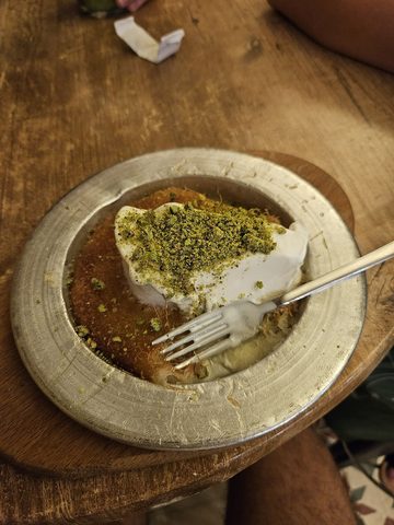 Representative photograph of Knafeh. The photograph includes a cream topping that is not part of this recipe.