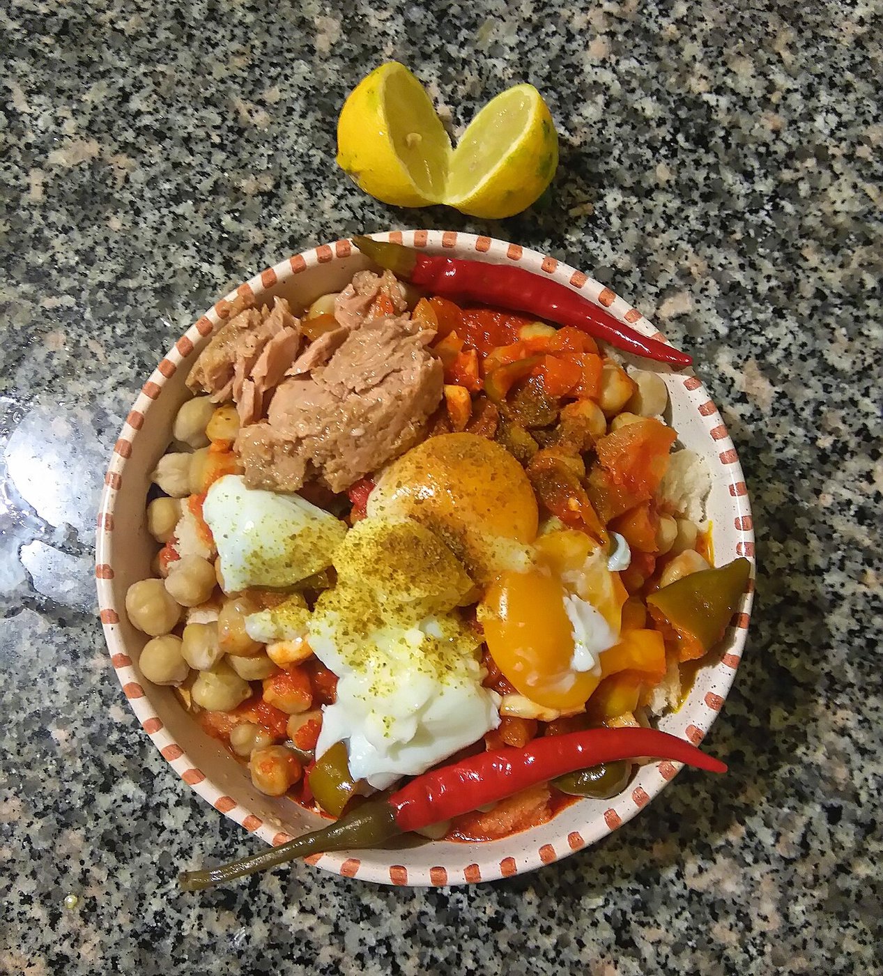 Representative photograph of Lablabi. The photograph includes egg and tuna toppings; this recipe uses chickpeas and bread without these toppings.