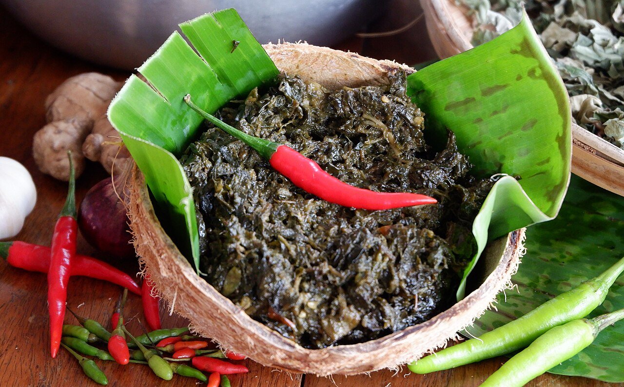 Representative photograph of Laing. The photograph includes a visible piece of fish; this recipe uses shrimp paste without a fish topping.