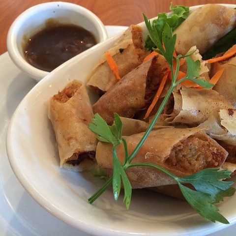 Representative photograph of Lumpiang Shanghai. The photograph includes dipping sauce and garnish not included in this recipe.