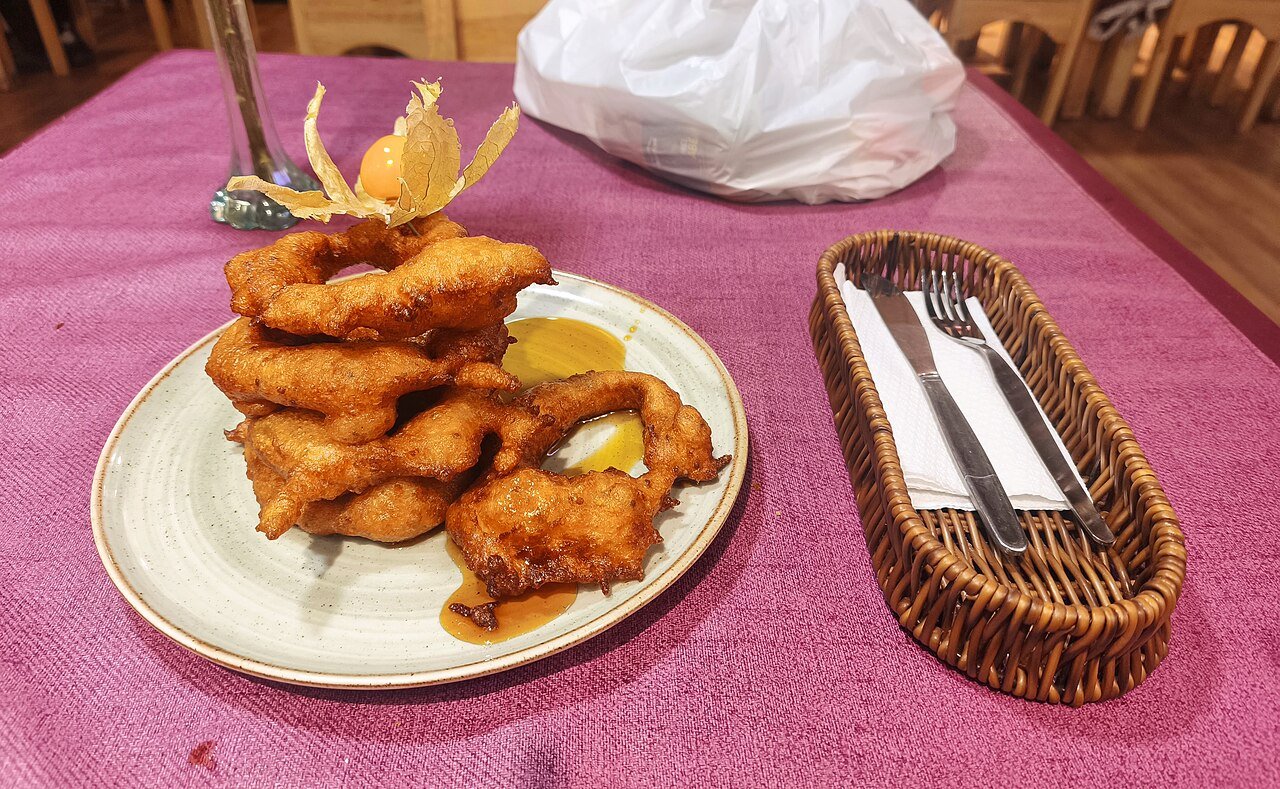 Representative photograph of Picarones. The photograph includes citrus garnish not included in this recipe.