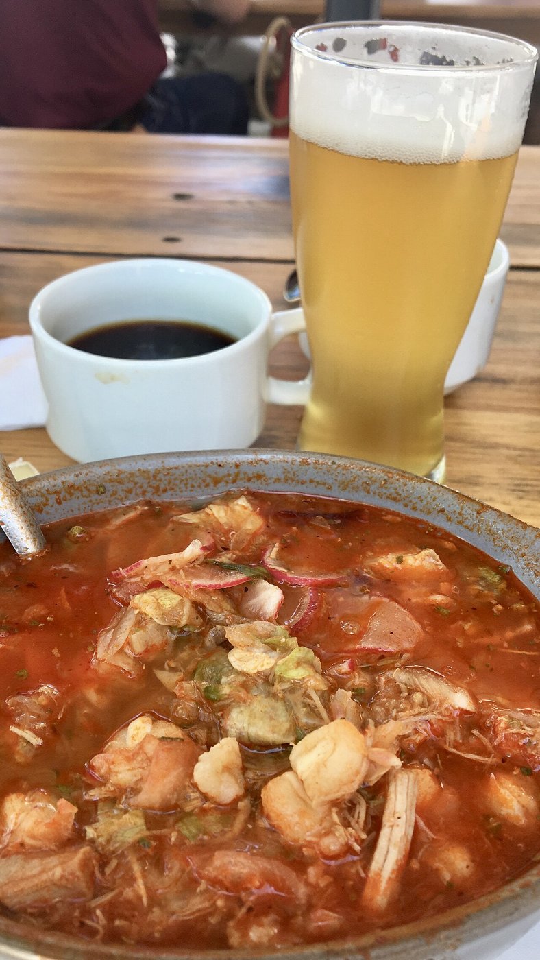 Representative photograph of Pozole Rojo. The photograph includes a drink not included in this recipe.