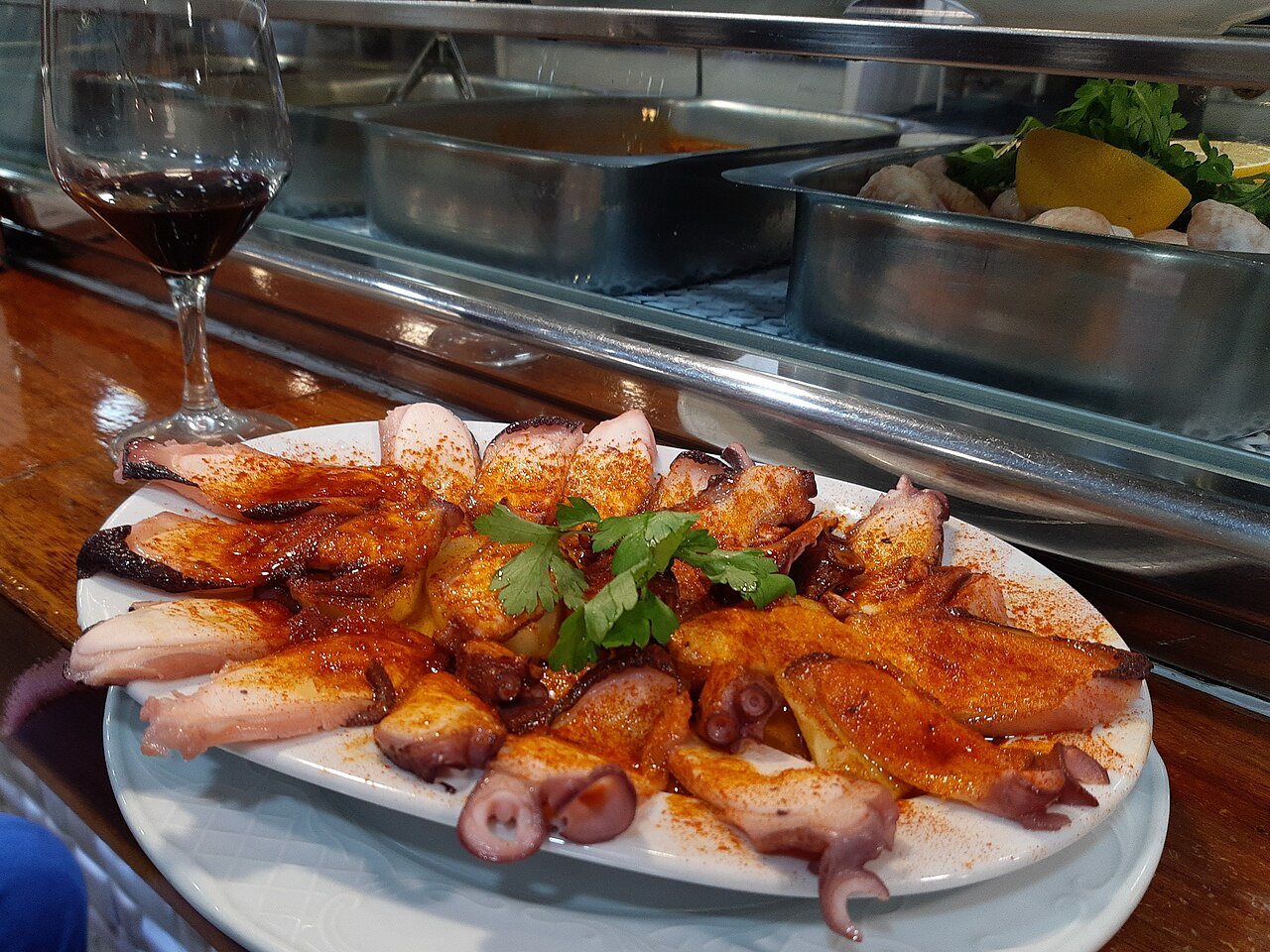 Representative photograph of Pulpo a la Gallega. The photograph includes salad garnishes not included in this recipe.