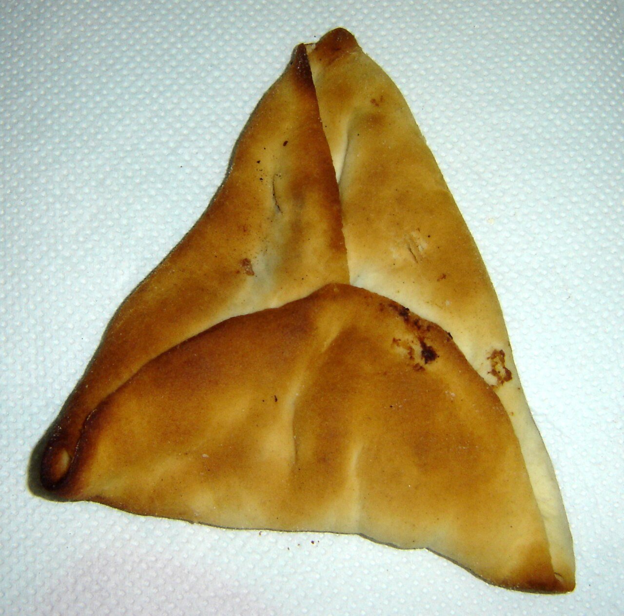 Representative photograph of Sfeeha. The photograph shows closed triangular sfeeha; this recipe makes open meat-topped rounds.
