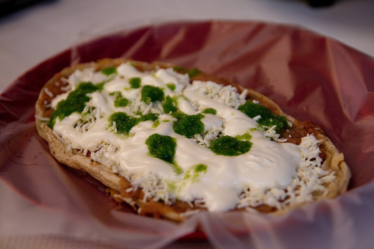 Representative photograph of Sopes. The photograph includes extra cream and cheese toppings that differ from this recipe.