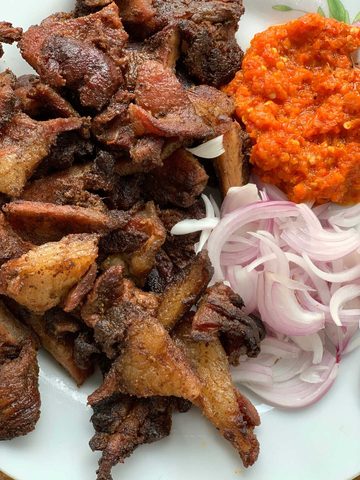 Representative photograph of Suya. The photograph includes onion and pepper sauce not included in this recipe.