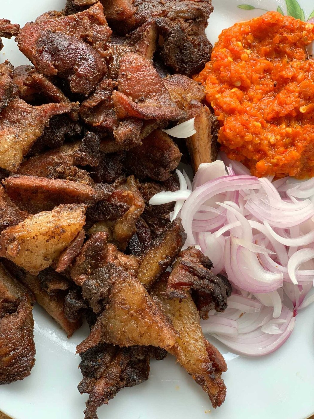 Representative photograph of Suya. The photograph includes onion and pepper sauce not included in this recipe.