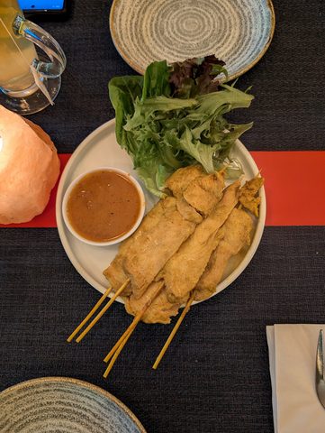 Representative photograph of Thai Chicken Satay. The photo includes a side salad not included in this recipe.