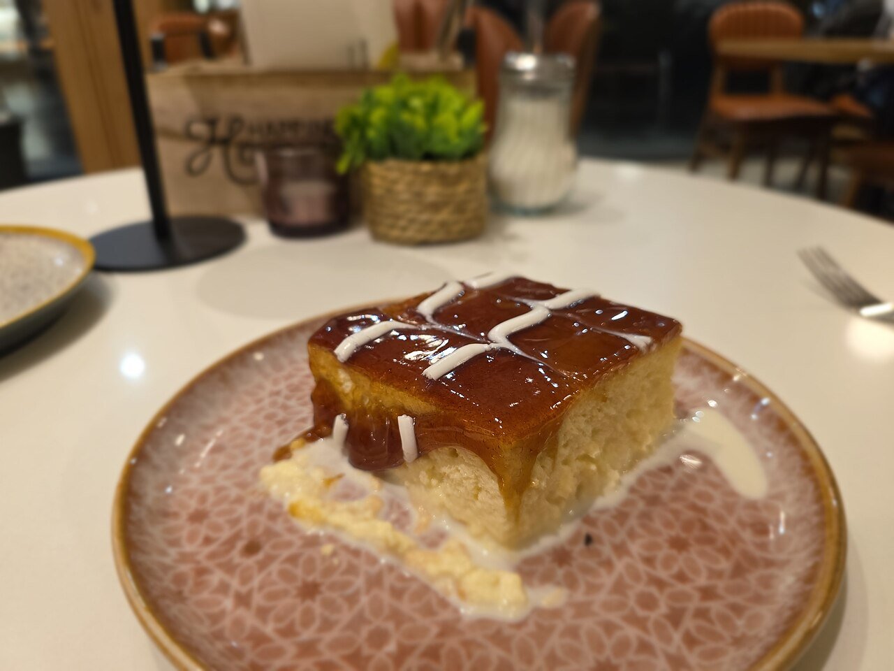 Representative photograph of Tres Leches Cake. The photograph includes a caramel topping; this recipe uses whipped cream.